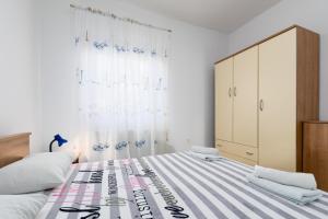 Postel nebo postele na pokoji v ubytování Apartments Snjezana by El-Pi Tours