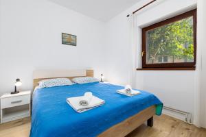 Postel nebo postele na pokoji v ubytování Apartments Snjezana by El-Pi Tours