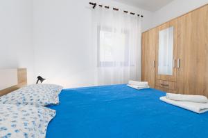 Postel nebo postele na pokoji v ubytování Apartments Snjezana by El-Pi Tours