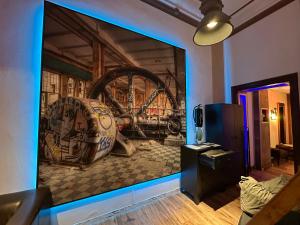 a living room with a large wall mural of a brewery at Einzigartige Ferienwohnung bunt wie Berlin in Berlin +18 photos
