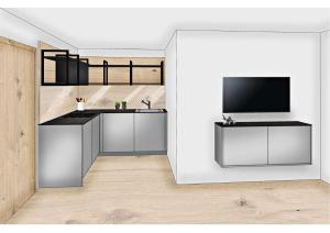 a room with a kitchen with a tv and a counter at Jungmann Apartments in Ischgl
