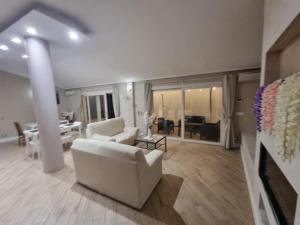 Coin salon dans l'établissement Garda Rooms da Miky Q