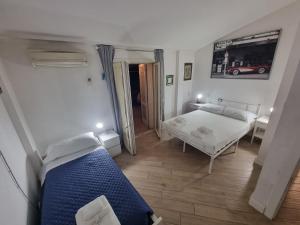 Un ou plusieurs lits dans un hébergement de l'établissement Garda Rooms da Miky Q