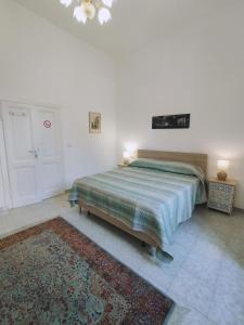 a bedroom with a bed and a rug at Rifugio del Quadraro Rome in Rome