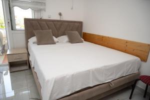 apartmani DENI客房内的一张或多张床位