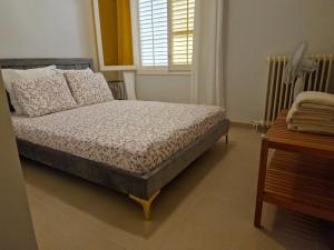 a bedroom with a bed and a window at Calafats in Lloret de Mar