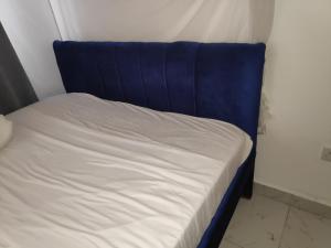 Postel nebo postele na pokoji v ubytování M & L Homes E7