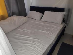 Postel nebo postele na pokoji v ubytování M & L Homes E7