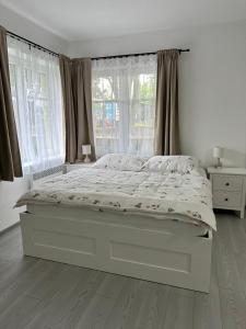 Postel nebo postele na pokoji v ubytování Apartmány Daros