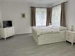 Postel nebo postele na pokoji v ubytování Apartmány Daros