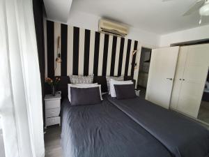 Posteľ alebo postele v izbe v ubytovaní M1 403 Frontal al Mar Vistas Terraza y Wifi