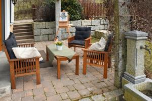 a group of chairs sitting on a patio at Ferienhaus Hombergshalden in Geisingen +23 photos
