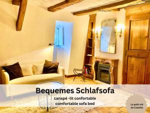 a living room with a couch and a fireplace at Maison de Castella next to Cathedrale in Fribourg