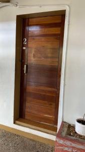 a wooden door with the number two on it at Cabongaoan Beach, Burgos, Pangasinan 