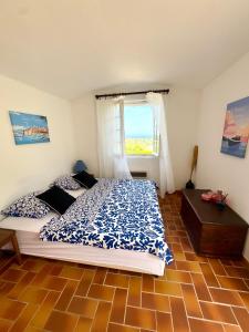 a bedroom with a large bed and a window at Le Fagneton - Seaview Villa Cote d'Azur in Roquebrune-sur-Argens +29 photos