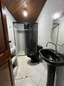 Et badeværelse på Casa por temporada - Cop 30 + 5 billeder