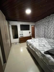 En eller flere senge i et værelse på Casa por temporada - Cop 30