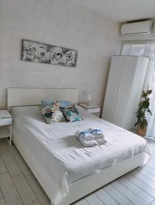 Postel nebo postele na pokoji v ubytování B&B La Palmetta