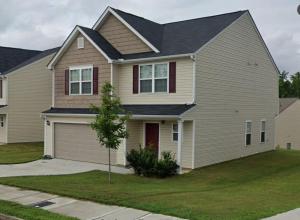 a large house with a garage at Guest House Haven with Gazebo in Riverdale