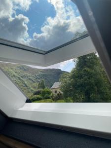 a window view of a mountain view from a train at Krokenes in Sylte