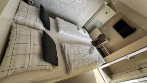 Una cama o camas en una habitación de Apartmani Mamić