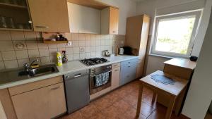 Una cocina o cocineta en Apartmani Mamić
