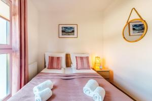 Postel nebo postele na pokoji v ubytování Sunset Resort Nadmorska 100