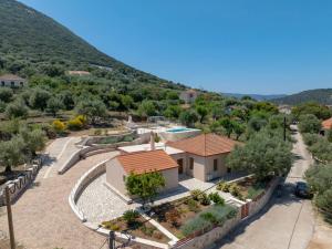 a villa with a swimming pool and a mountain at Villa Emmelia in Stavros