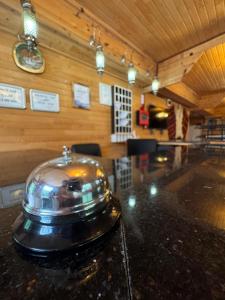 a silver bowl on a counter in a room at Yedigoller Hotel & Restaurant in Uzungöl