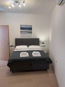 Posteľ alebo postele v izbe v ubytovaní Apartments ATM + 37 fotografií