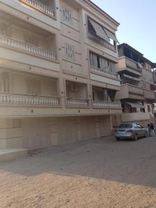 a building with a car parked in front of it at رأس البر in Ras El Bar
