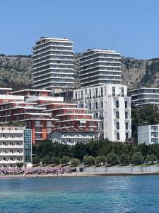 a group of buildings on the shore of a beach at Sunrise Home Getaway - Shëngjin in Shëngjin