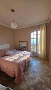 Ένα ή περισσότερα κρεβάτια σε δωμάτιο στο Villa Propriano vue mer
