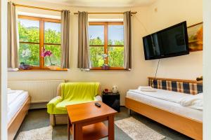 Voodi või voodid majutusasutuse Garni Hotel Gavurky toas
