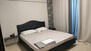 Ένα ή περισσότερα κρεβάτια σε δωμάτιο στο M&G comfort home