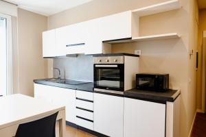 Kuchyň nebo kuchyňský kout v ubytování T&L-Home