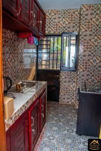 Η κουζίνα ή μικρή κουζίνα στο Chambre privée dans appart à Bafoussam Diengdam proche agence BlueBird