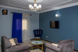 Χώρος καθιστικού στο Chambre privée dans appart à Bafoussam Diengdam proche agence BlueBird