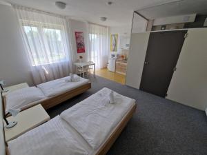 Postel nebo postele na pokoji v ubytování Ubytovna Kubra