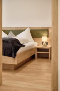Postel nebo postele na pokoji v ubytování Das Refugium Mountain Apartment Ötztal - Längenfeld
