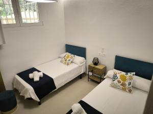 Posteľ alebo postele v izbe v ubytovaní family apartment near of beach