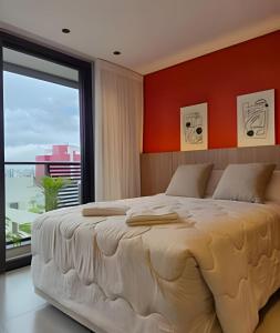 En eller flere senge i et værelse på IncoMpArÁvEl Studio MoDeRno c/Sacada e Garagem