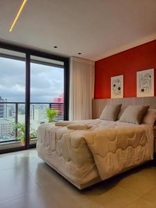 En eller flere senge i et værelse på IncoMpArÁvEl Studio MoDeRno c/Sacada e Garagem