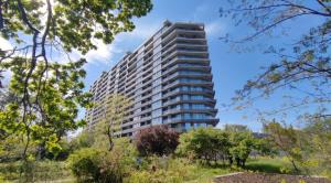 a tall building in the middle of a park at City Rooms Greenwood in Odesa