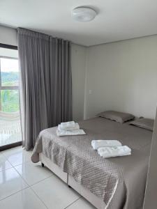 Postel nebo postele na pokoji v ubytování Alto da Serra Villas - Flat 301 + 7 fotografií