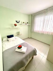 Ένα ή περισσότερα κρεβάτια σε δωμάτιο στο APARTBEACH NARGAM Vista Playa