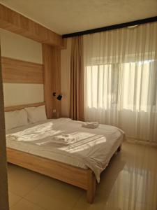 Postel nebo postele na pokoji v ubytování Hotel Kerchova - Kichevo