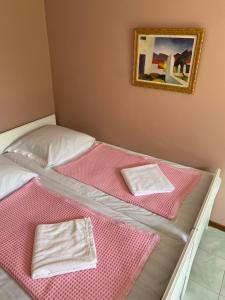 A bed or beds in a room at Vakho house