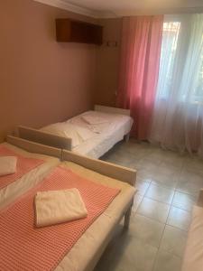A bed or beds in a room at Vakho house
