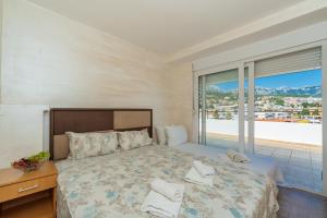 Postel nebo postele na pokoji v ubytování Apart Hotel S Lux